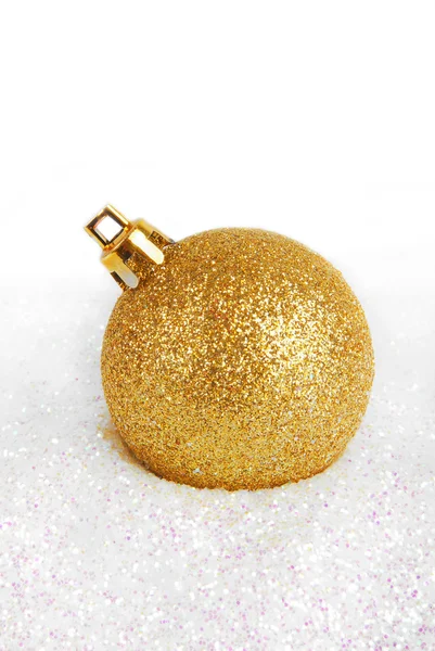 Christmas golden bauble with glitter — Stock Photo, Image