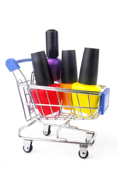 Fingernail enamel in shopping trolley — Stock Photo, Image