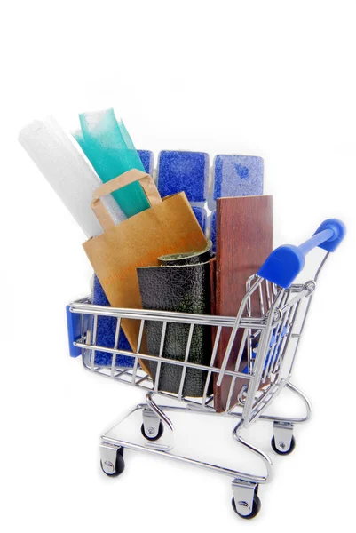 Shopping trolley with various materials — Stock Photo, Image