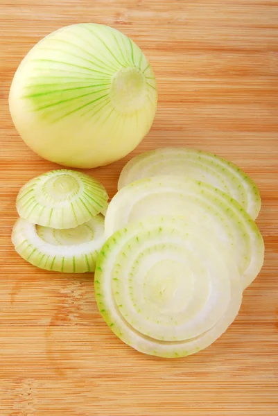 Onion cutting  on board — Stock Photo, Image