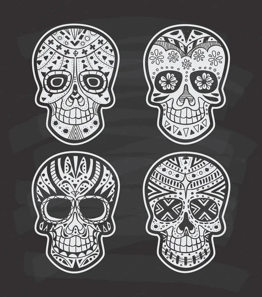 Set of decorated sugar skulls — Stock Vector