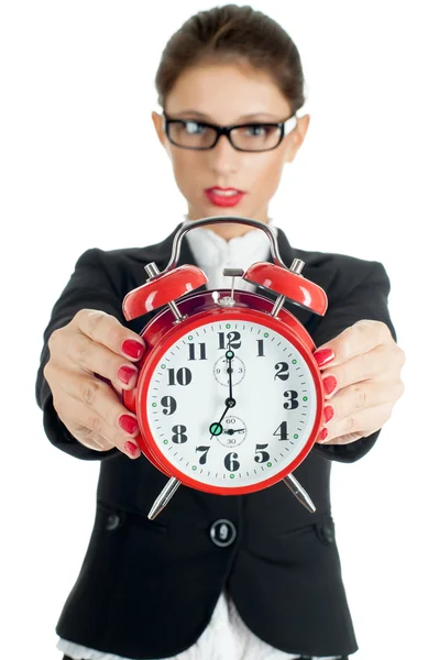 Woman holding out clock Royalty Free Stock Photos