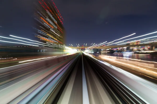 Desfoque de movimento de uma cidade e túnel — Fotografia de Stock