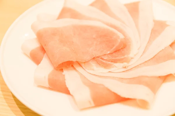 Pork slices on plate — Stock Photo, Image