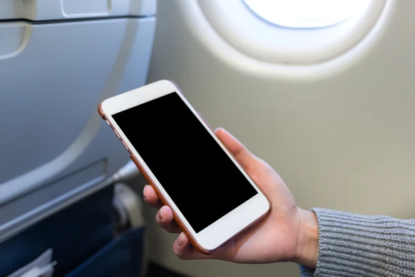 Woman holding mobile phone — Stock Photo, Image