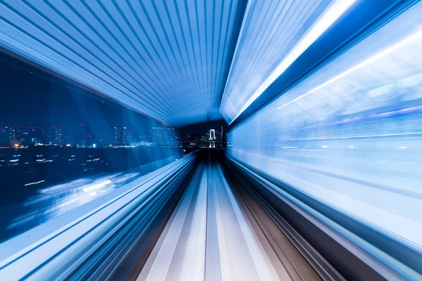 Speedy train passing through the city — Stock Photo, Image