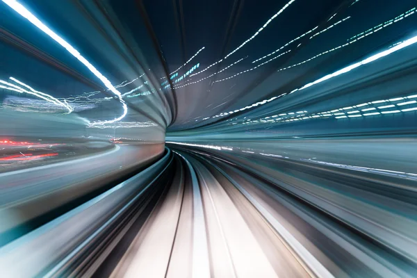 Speedy train passing through the city — Stock Photo, Image