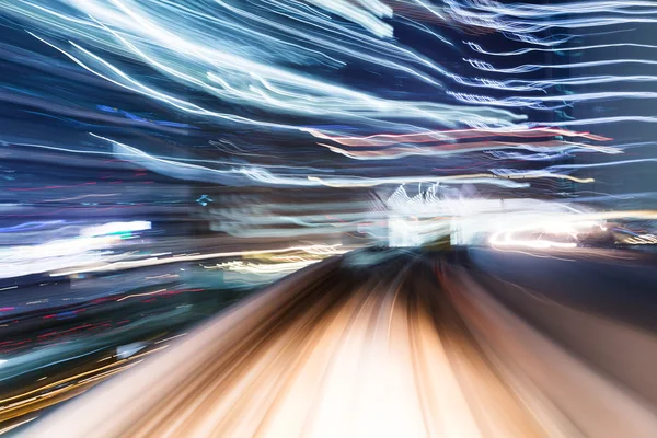 Light trail accelerating through a tunnel — Stock Photo, Image