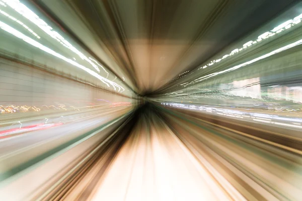 Train moving fast inside tunnel — Stock Photo, Image