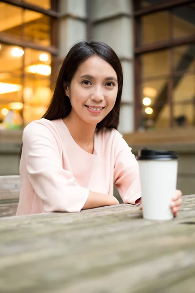 Asian woman with coffee cup