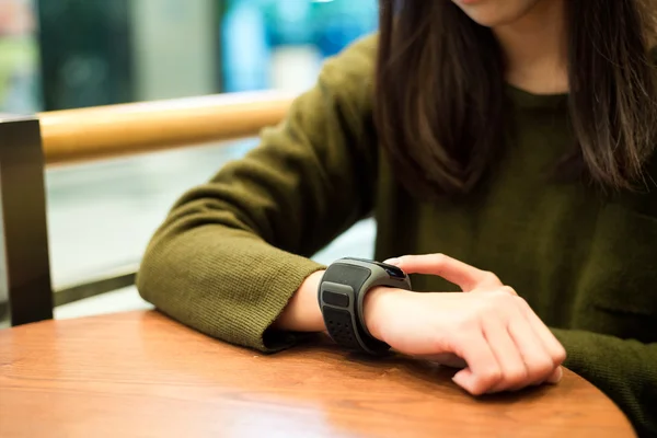 Woman touch on the smart watch — Stock Photo, Image