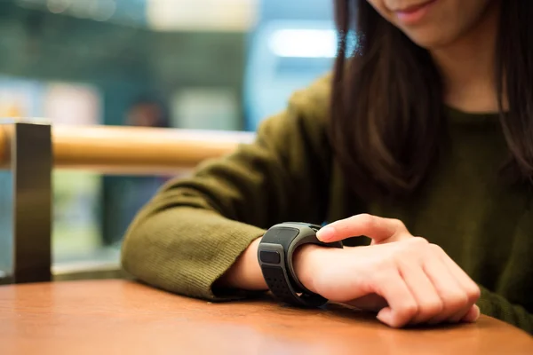 Woman touch on the screen of smart watch — Stock Photo, Image