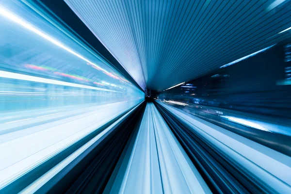 Train moving fast inside tunnel — Stock Photo, Image