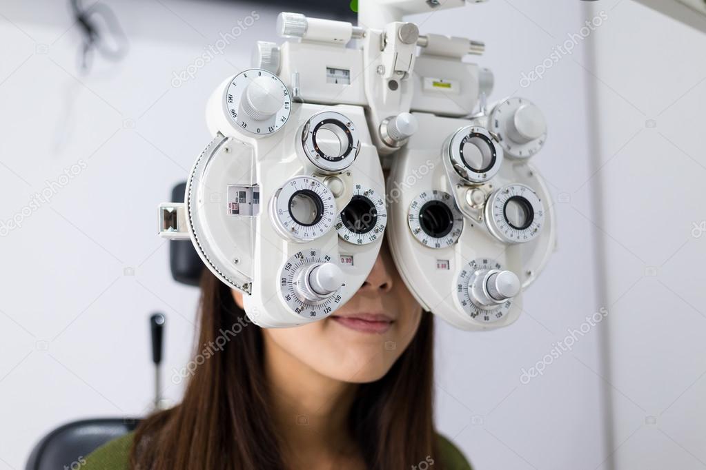 woman during an eye examination at clinic