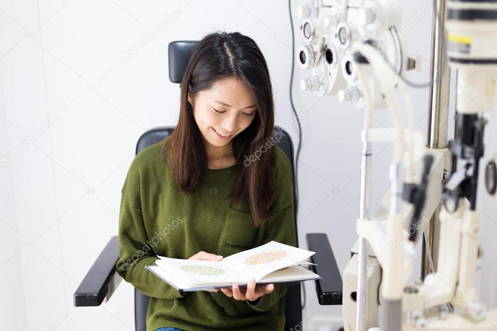 woman during an eye examination at clinic