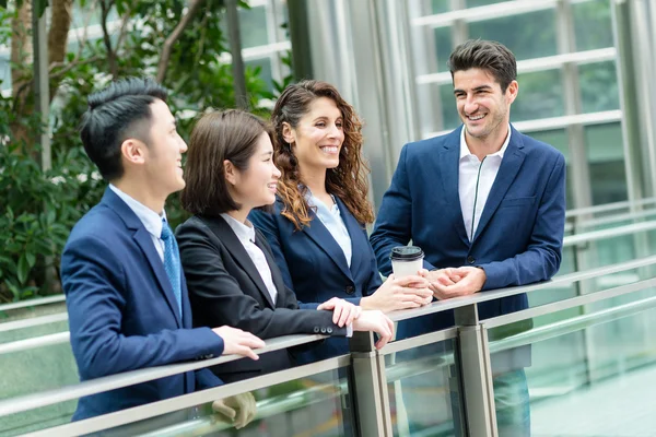 Business people chatting outside office — Stock Photo, Image