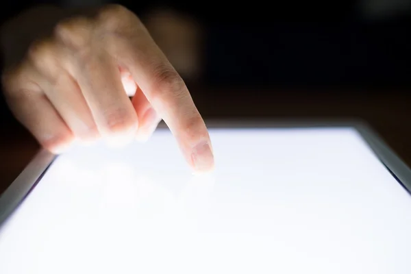 Woman touching the screen of digital tablet — Stock Photo, Image