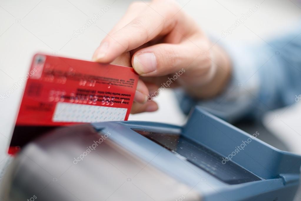 Hand Swiping Credit Card In Store