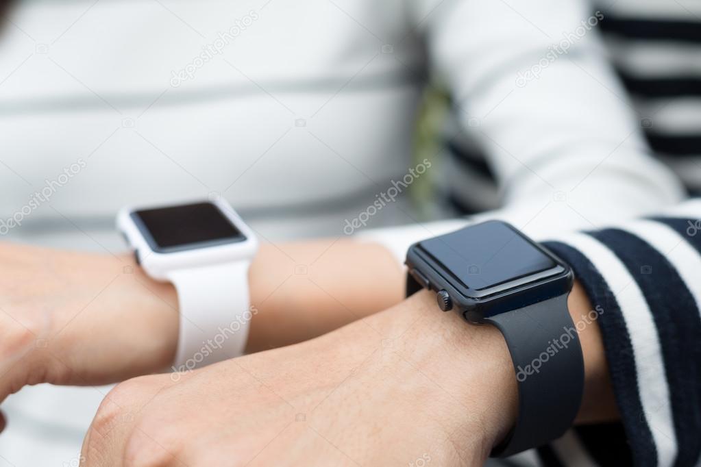 Couple using smart watches