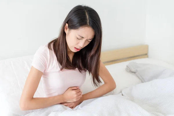 Woman suffering from stomach pain — Stock Photo, Image