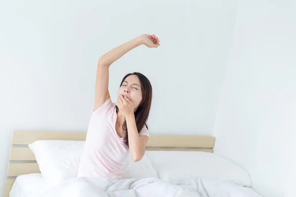 Woman yawning after waking up — Stock Photo, Image