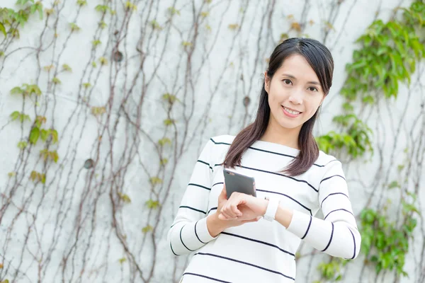 Asian young woman in striped sweater — Stock Photo, Image