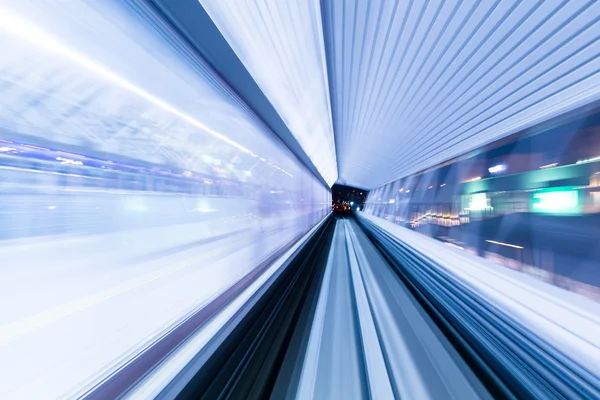 Train moving fast inside tunnel — Stock Photo, Image