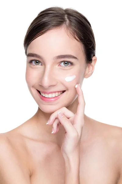 Woman applying cream on her face — Stock Photo, Image