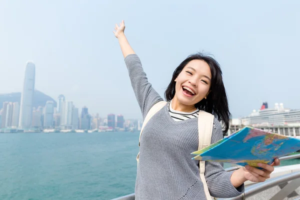 Thrilled Asian young woman with map — Stock Photo, Image