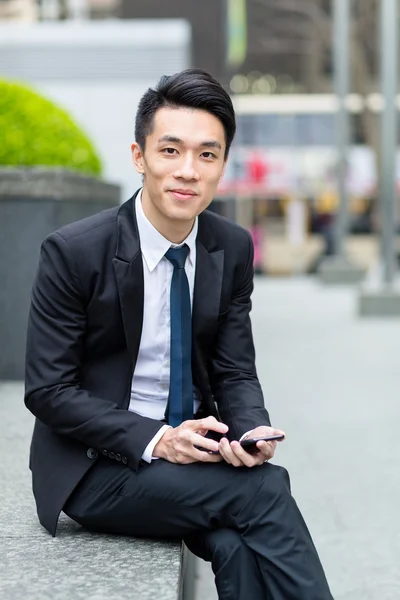 Young asian businessman in business suit