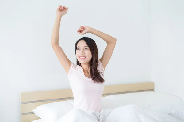 Woman waking up and stretching — Stock Photo, Image