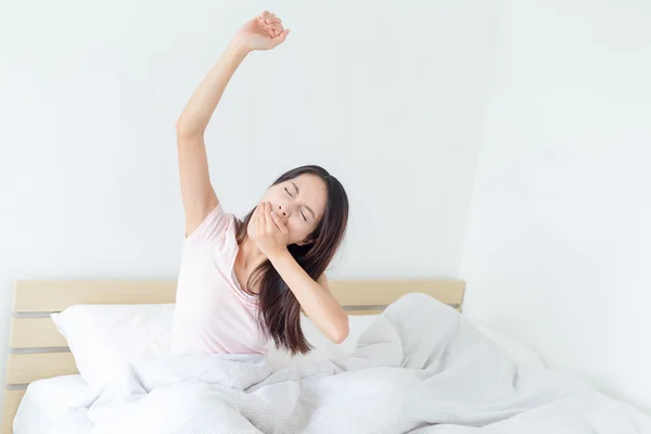 Woman waking up and stretching — Stock Photo, Image