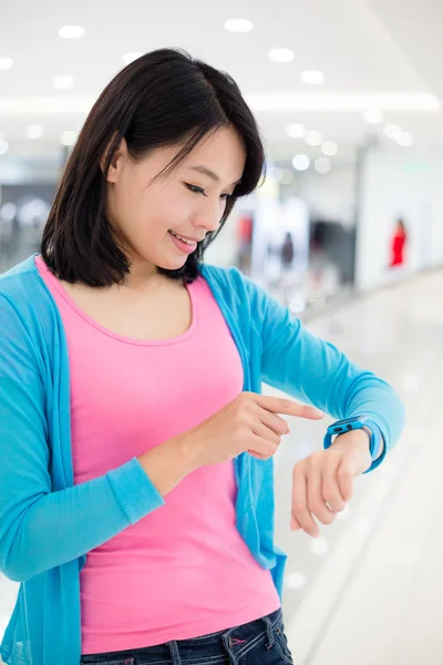 woman using wearable smart watch