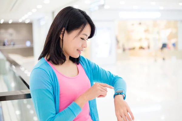 Woman using wearable smart watch — Stock Photo, Image