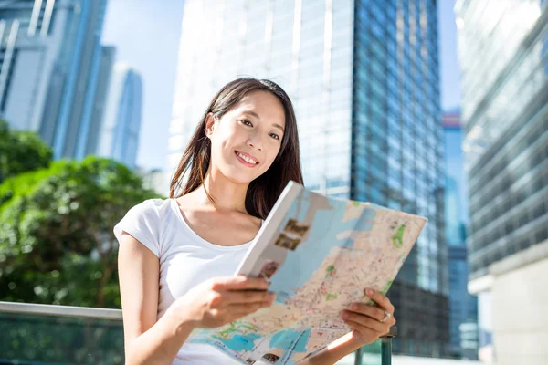 woman using city map in Hong Kong