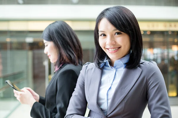 Asian businesswomen standing outside office — Stock Photo, Image