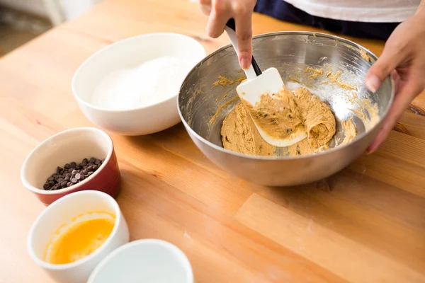 Woman mixing the dough — Stock Photo, Image