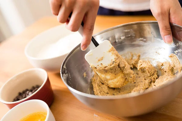 Mixing paste inside bowl by hand — Stock Photo, Image