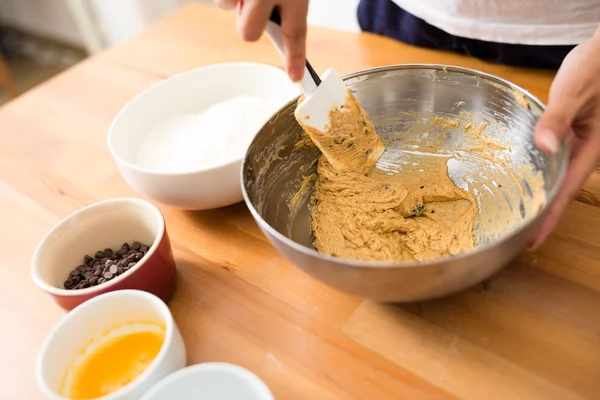 Mixing dough in bowl by hand — Stock Photo, Image