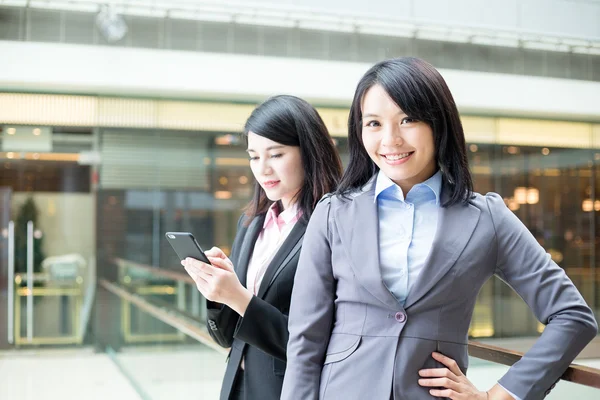 Asian businesswomen standing outside office — Stock Photo, Image