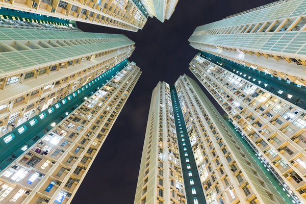 Exterior of buildings facade from low angle at night in Hong Kong