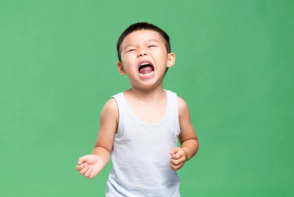 Asiatiska liten pojke visar en grimas — Stockfoto