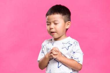 Asian little boy praying clipart