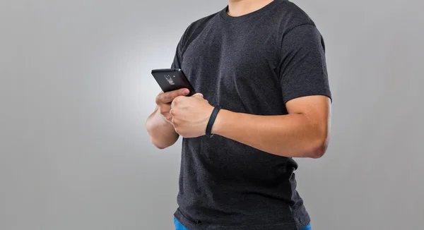 Man use mobile phone sync with wearble device — Stock Photo, Image