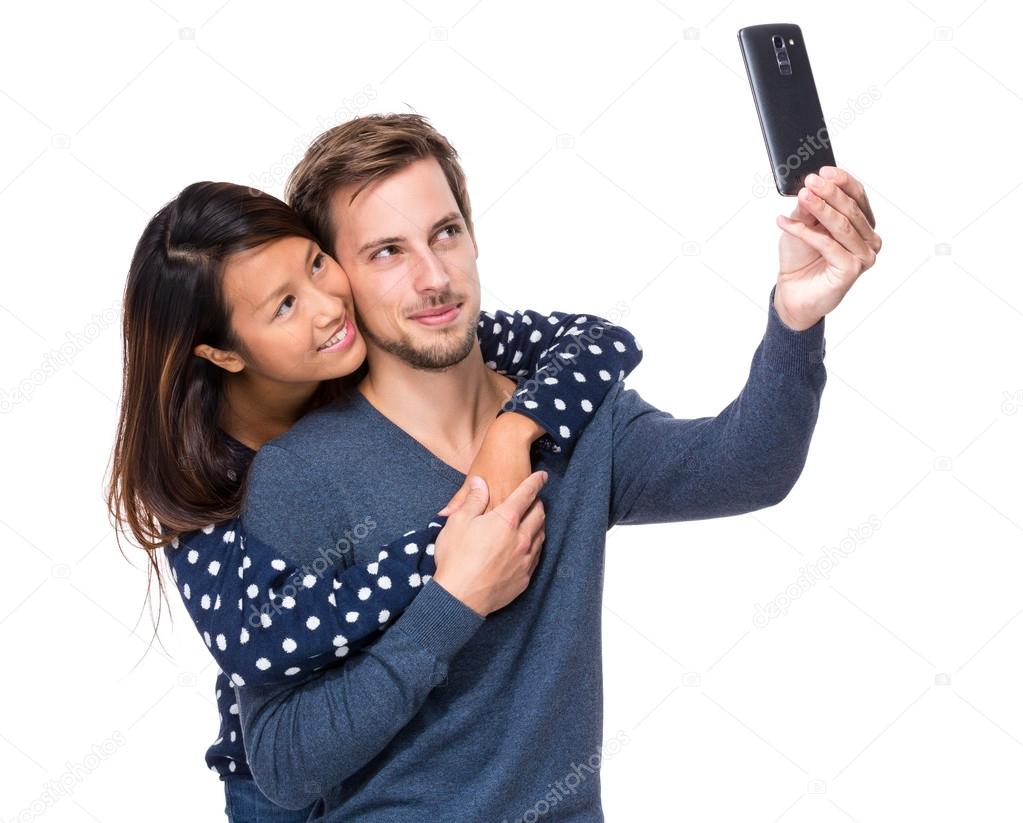 Young couple take selfie