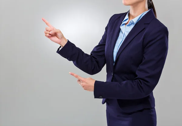 Businesswoman two finger point aside — Stockfoto