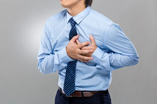 Businessman with heart stroke — Stock Photo, Image