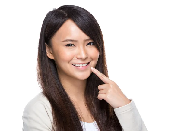 Woman with finger point to teeth — Stock Photo, Image