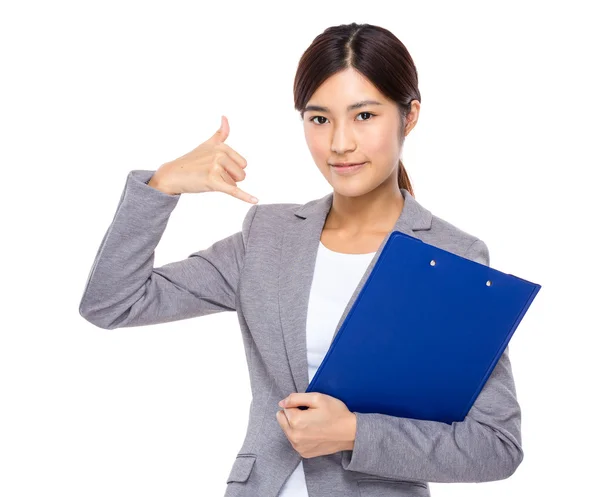 Businesswoman with clipboard and call me sign — Stock Photo, Image