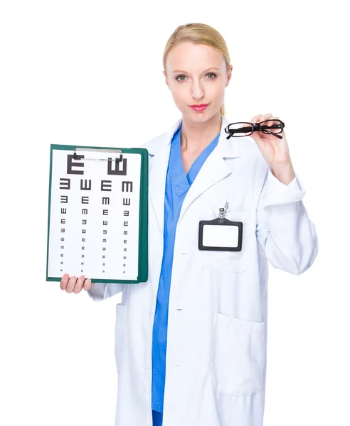 Optician doctor with eye chart and glasses — Stock Photo, Image